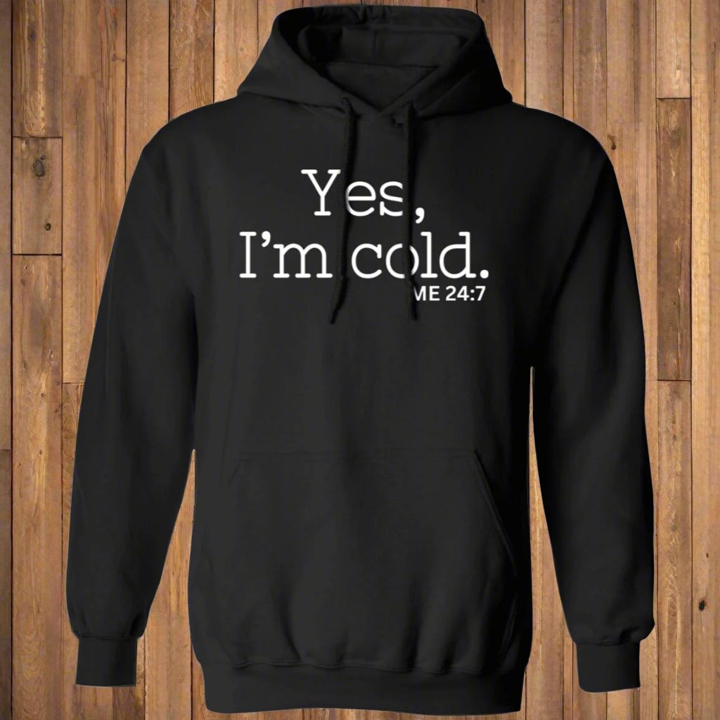 'Yes, I'm Cold' design on a black hoodie with soft fabric texture visible.